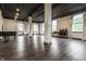 Bright studio featuring wood floors, exposed ducts and support beams, track lighting, and several windows at 3959 Central Ave, Indianapolis, IN 46205