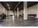 Spacious studio features wood floors, high ceilings, track lighting, support beams, grand piano, and an open floorplan at 3959 Central Ave, Indianapolis, IN 46205