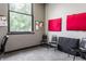 Small studio space featuring carpeted floors, a window overlooking the outdoors, and sound dampening panels on the wall at 3959 Central Ave, Indianapolis, IN 46205