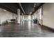 Large studio space featuring hardwood floors, high ceilings, ample lighting, and several windows overlooking the outdoors at 3959 Central Ave, Indianapolis, IN 46205