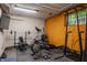Bright workout room includes a variety of exercise equipment, great for staying fit and active at 3959 Central Ave, Indianapolis, IN 46205