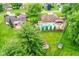 Aerial perspective of the property highlighting the pool, patio area, and surrounding greenery at 4080 Wander Way, Greenwood, IN 46142