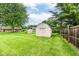 Spacious backyard with a storage shed and a privacy fence, offering a serene outdoor space at 4080 Wander Way, Greenwood, IN 46142