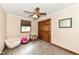 Neutral bedroom with hardwood-style floors, a ceiling fan, a closet, and a window at 4080 Wander Way, Greenwood, IN 46142