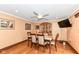 Dining room with wood floors, modern fan, and sliding doors offer a view of the outdoor area at 4080 Wander Way, Greenwood, IN 46142