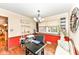 Bright home office with modern desk, hardwood floors, and a view of the backyard pool at 4080 Wander Way, Greenwood, IN 46142