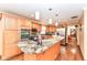 Beautiful kitchen with a large island, stainless steel appliances, and hardwood floors at 4080 Wander Way, Greenwood, IN 46142