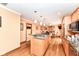 Updated kitchen boasts granite countertops, stainless appliances, island cooktop, and a seamless open floorplan at 4080 Wander Way, Greenwood, IN 46142