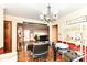 Open layout featuring a home office, living room area, and an entryway with hardwood floors at 4080 Wander Way, Greenwood, IN 46142