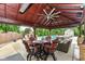 Outdoor patio featuring a covered seating area, fireplace, and view of the swimming pool at 4080 Wander Way, Greenwood, IN 46142