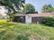 Charming single-story home with a brick facade and a well-maintained lawn with healthy green grass at 4408 Clovelly Ct, Indianapolis, IN 46254