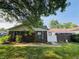 Charming single-story home with a brick facade and a well-maintained lawn with healthy green grass at 4408 Clovelly Ct, Indianapolis, IN 46254