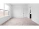 Bright bedroom with natural light, plush carpet, and an ensuite bathroom at 443 Flora Pl, Carmel, IN 46290