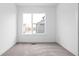 Cozy bedroom with neutral carpeting and a large window offering plenty of natural light at 443 Flora Pl, Carmel, IN 46290