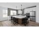 Spacious kitchen with a large island, white cabinetry, and stainless steel appliances at 443 Flora Pl, Carmel, IN 46290