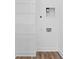 Bright laundry room with white walls, wood-look flooring, and washer/dryer hookups at 443 Flora Pl, Carmel, IN 46290