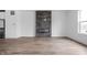 Open living room featuring wood floors, a fireplace and large windows for natural light at 443 Flora Pl, Carmel, IN 46290