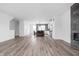 Spacious open-concept living room with kitchen, wood floors and plenty of natural light at 443 Flora Pl, Carmel, IN 46290