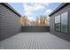 Large rooftop deck provides a private outdoor space with views of fall foliage beyond the house at 443 Flora Pl, Carmel, IN 46290