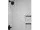Modern shower with white subway tile, a shower head, and convenient corner shelves at 443 Flora Pl, Carmel, IN 46290