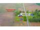 Aerial view of property showing approximate boundary lines, the house, barn, and surrounding greenery at 4491 W 600 N, Anderson, IN 46011