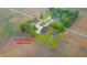 Aerial view displaying the property with approximate lines, showcasing home, barn, and expansive acreage at 4491 W 600 N, Anderson, IN 46011