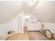 Cozy attic bedroom nook featuring white dresser and natural light to provide a relaxing space at 4491 W 600 N, Anderson, IN 46011