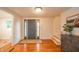Welcoming foyer with wood floors, a stylish front door, and natural light from side windows at 4491 W 600 N, Anderson, IN 46011