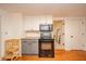 Functional kitchen with butcher block countertops, two-tone cabinets, and modern appliances at 4491 W 600 N, Anderson, IN 46011