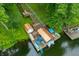 Aerial view of the boat dock with multiple boats and stair access to the home above at 460 W Hinshaw Dr, Nineveh, IN 46164