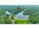 Aerial view of the lake showing the property location in a heavily wooded area at 460 W Hinshaw Dr, Nineveh, IN 46164