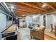 Finished basement with a kitchenette, open ceiling, recreation space, and vinyl flooring at 460 W Hinshaw Dr, Nineveh, IN 46164