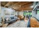 Finished basement with a kitchenette, open ceiling, and access to the outdoor area at 460 W Hinshaw Dr, Nineveh, IN 46164