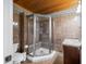 The bathroom includes a shower with glass doors and brown tile and wood ceiling at 460 W Hinshaw Dr, Nineveh, IN 46164