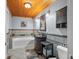 Bathroom featuring a white tub, tiled walls and vanity with under sink storage at 460 W Hinshaw Dr, Nineveh, IN 46164