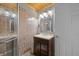 Bathroom features sink with vanity and brown tile walls and wood ceiling at 460 W Hinshaw Dr, Nineveh, IN 46164