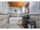 Bathroom with tiled walls, wood plank ceiling, granite countertop vanity, and a modern soaking tub at 460 W Hinshaw Dr, Nineveh, IN 46164