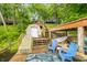 Wooden boat dock with lake access, a storage shed and furniture at 460 W Hinshaw Dr, Nineveh, IN 46164