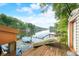 A wooden boat dock with boats and a view of the lake at 460 W Hinshaw Dr, Nineveh, IN 46164