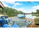 Wooden boat dock with lake access and lawn furniture at 460 W Hinshaw Dr, Nineveh, IN 46164