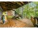 Multi level wooden deck with spiraling staircase, outdoor seating, and wooded views at 460 W Hinshaw Dr, Nineveh, IN 46164
