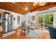 Dining area with a glass-top table, hardwood floors, and stainless steel refrigerator nearby at 460 W Hinshaw Dr, Nineveh, IN 46164