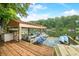 Covered boat dock with kayaks, seating and views of the serene lake at 460 W Hinshaw Dr, Nineveh, IN 46164