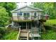 Charming home with a multilevel wooden deck, spiral staircase and mature trees at 460 W Hinshaw Dr, Nineveh, IN 46164