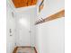 Open foyer features wood floors, entry doors, board and batten walls, and a coat rack at 460 W Hinshaw Dr, Nineveh, IN 46164