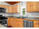 The kitchen features stainless steel appliances, light wood cabinets, granite countertops, and a window at 460 W Hinshaw Dr, Nineveh, IN 46164