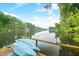 Scenic lake view showing kayaks, blue sky, and distant homes on the water at 460 W Hinshaw Dr, Nineveh, IN 46164