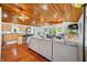 Bright living room with hardwood floors, wood ceiling, comfortable seating, and an open-concept design at 460 W Hinshaw Dr, Nineveh, IN 46164