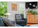 Cozy sitting area featuring hardwood floors and natural light, offering a comfortable space to relax and unwind at 460 W Hinshaw Dr, Nineveh, IN 46164