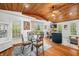 Inviting living room features hardwood floors, wood ceilings, dining area and sliding glass doors at 460 W Hinshaw Dr, Nineveh, IN 46164